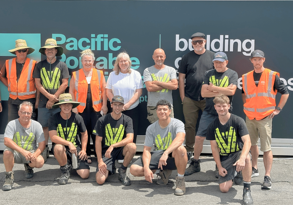 Pacific Portable Buildings team The Pacific Portable Buildings team in front of a screen featuring their logo.
