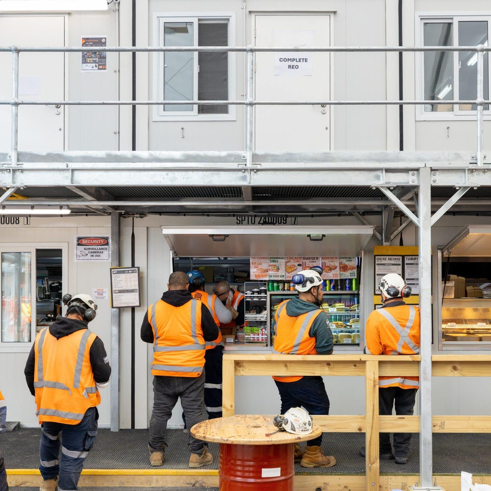 Portable lunch and break room by Pacific Portable Buildings Construction crew lining up to have lunch at a portable break room installed by Pacific Portable Buildings.