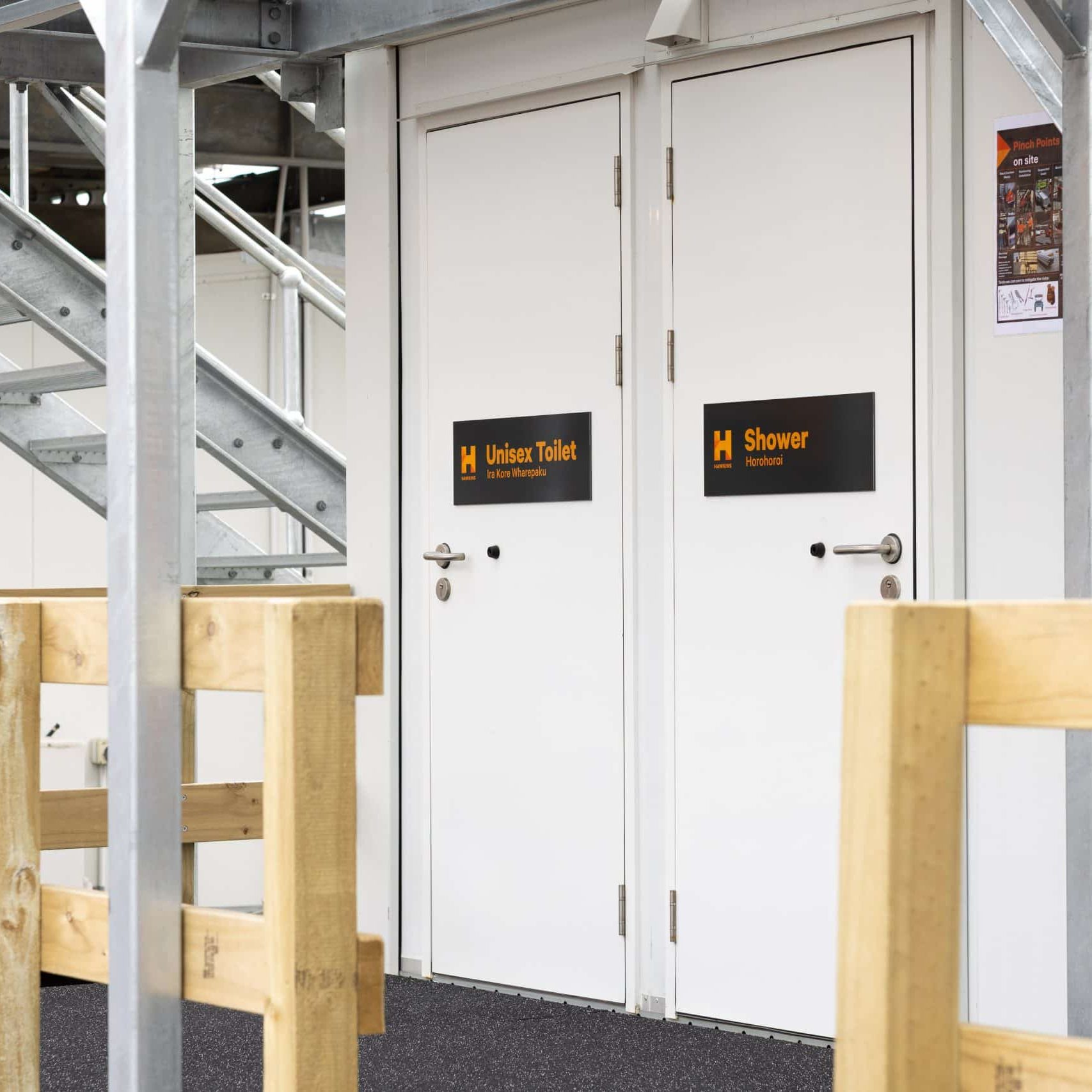 Portable toilets Auckland - Pacific Portable Buildings A portable unisex toilet and shower on a Pacific Portable Buildings site in Auckland.